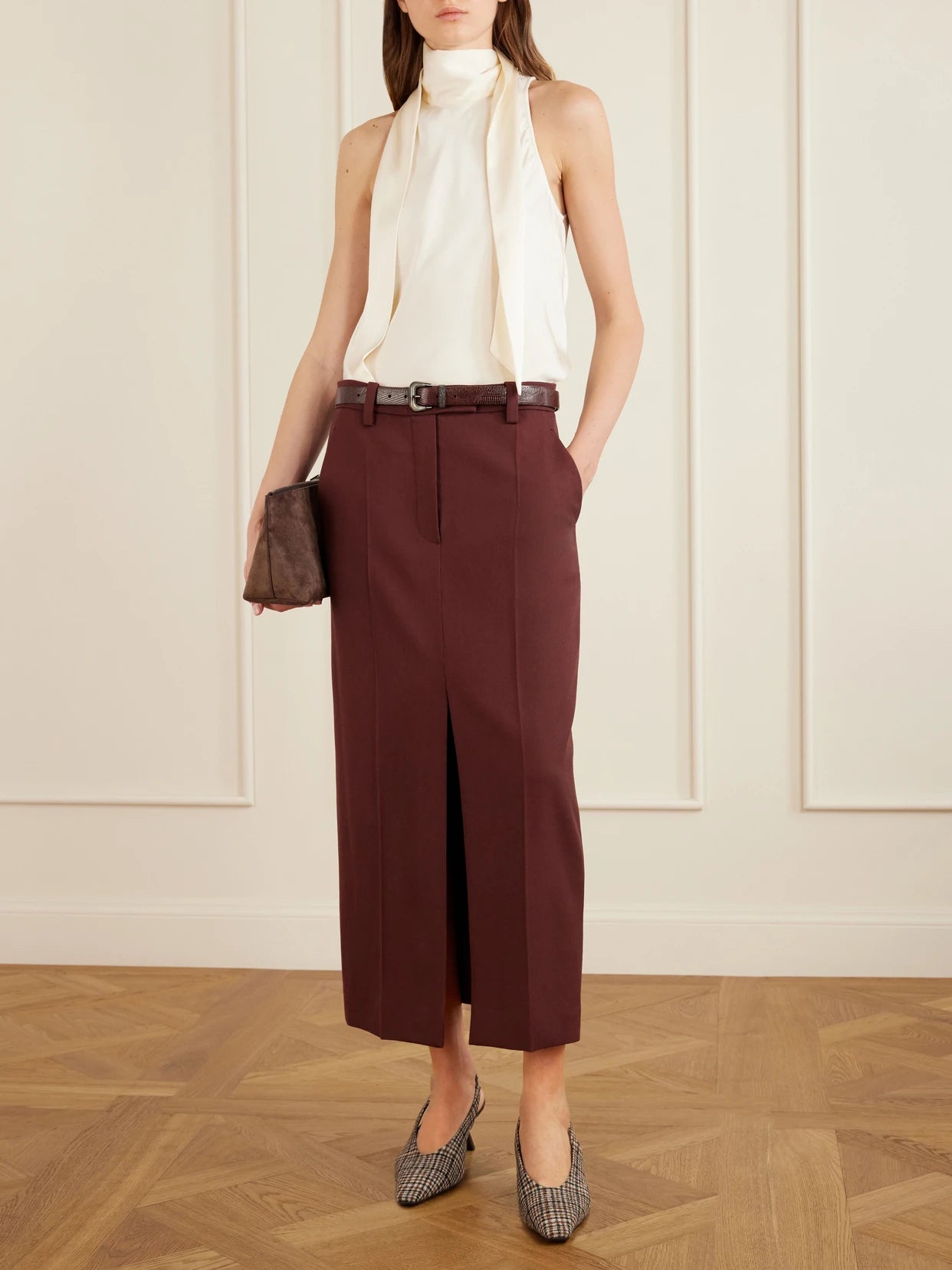 Image of a model wearing Skirts. Product name - Wool Midi Skirt in Burgundy colour by brand - Brunello Cucinelli
