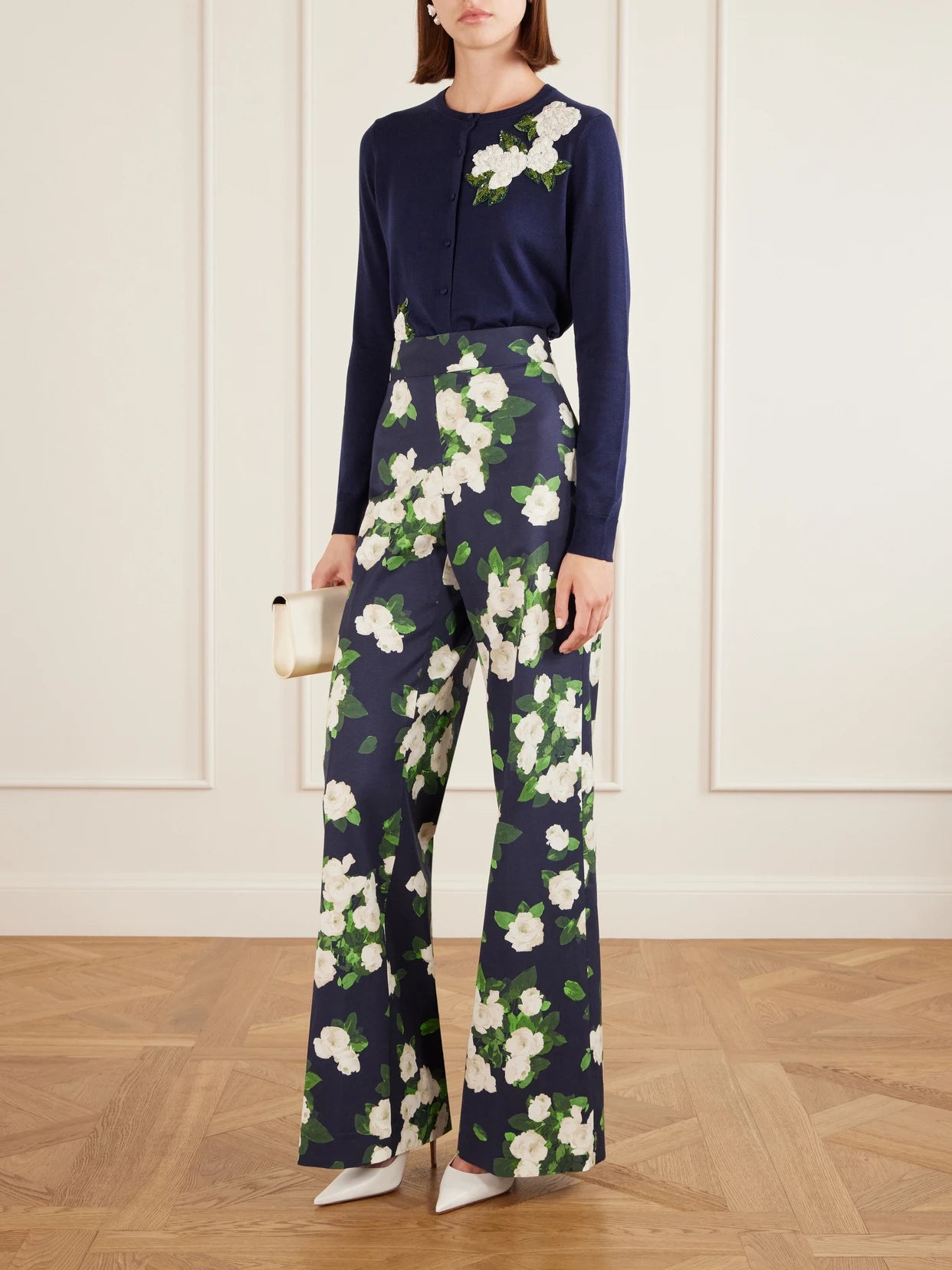 Image of a model wearing Outerwear. Product name - Floral-embellished Silk And Cotton-blend Cardigan in Navy colour by brand - Carolina Herrera