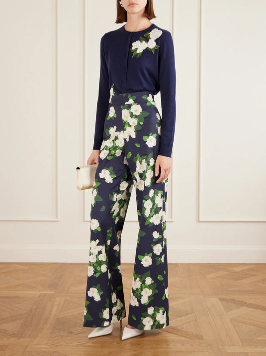 Image of a model wearing Outerwear. Product name - Floral-embellished Silk And Cotton-blend Cardigan in Navy colour by brand - Carolina Herrera