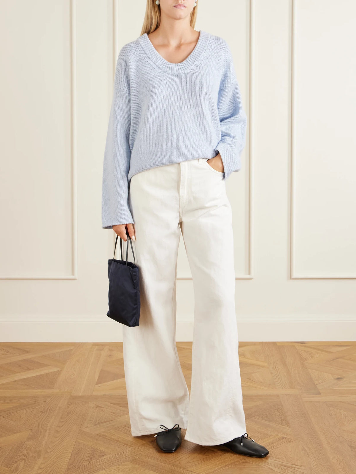 Image of a model wearing Outerwear. Product name - Derry Cashmere Sweater in Light blue colour by brand - Loulou de Saison