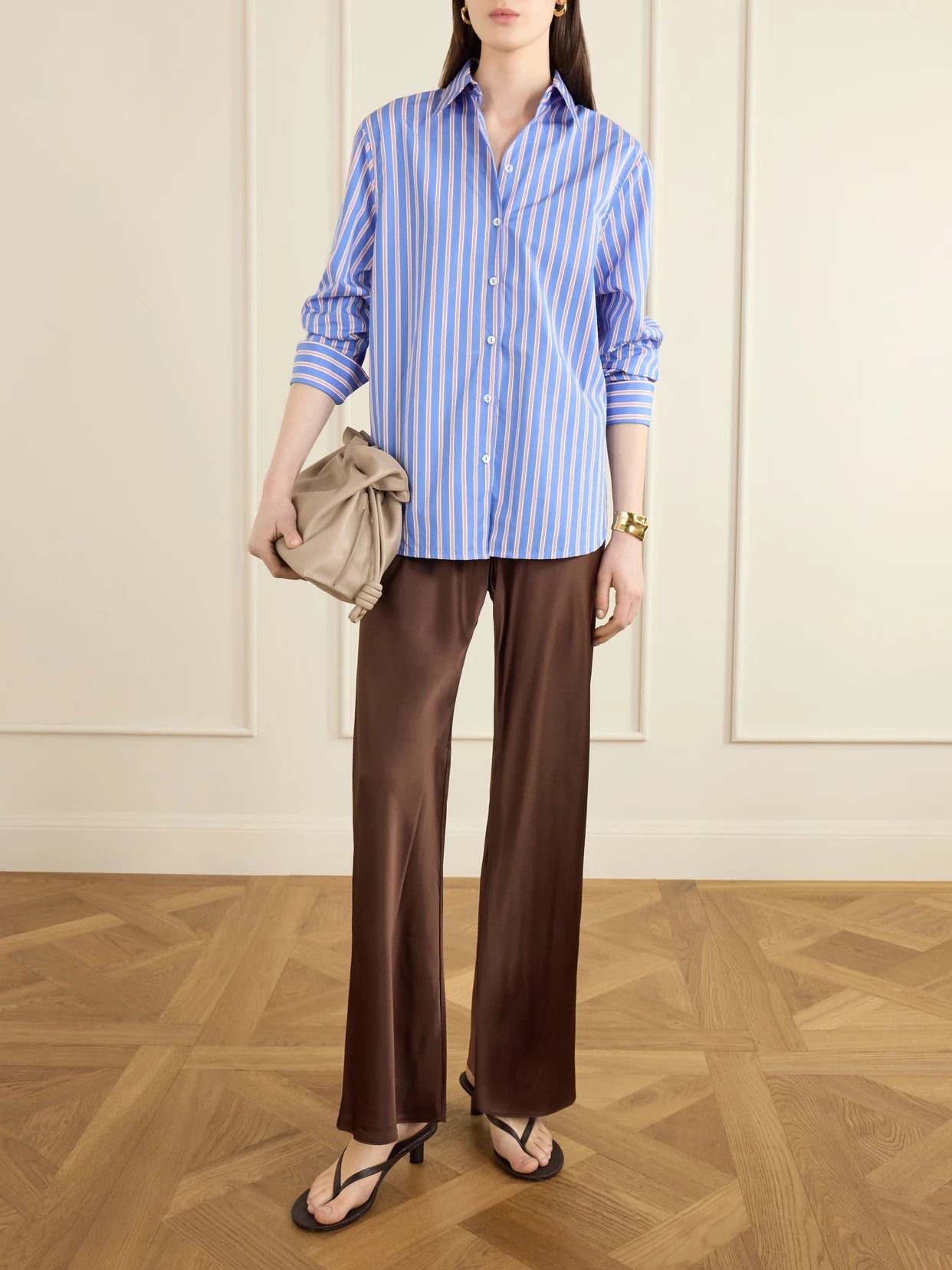 Image of a model wearing Pants. Product name - Bias Appliquéd-silk Straight-leg Pants in Dark brown colour by brand - Comme Si
