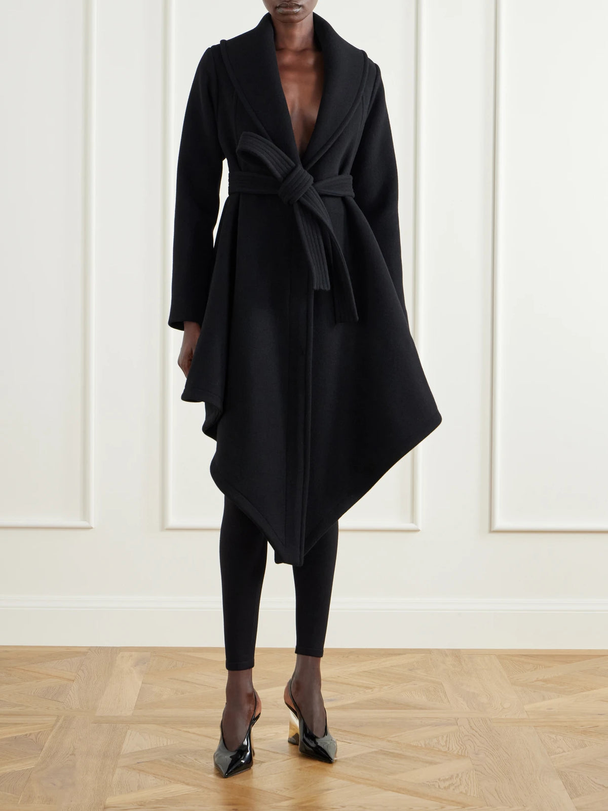Image of Coats & Jackets. Product name - Belted Asymmetric Draped Virgin Wool Coat in Black colour by brand - Alaïa