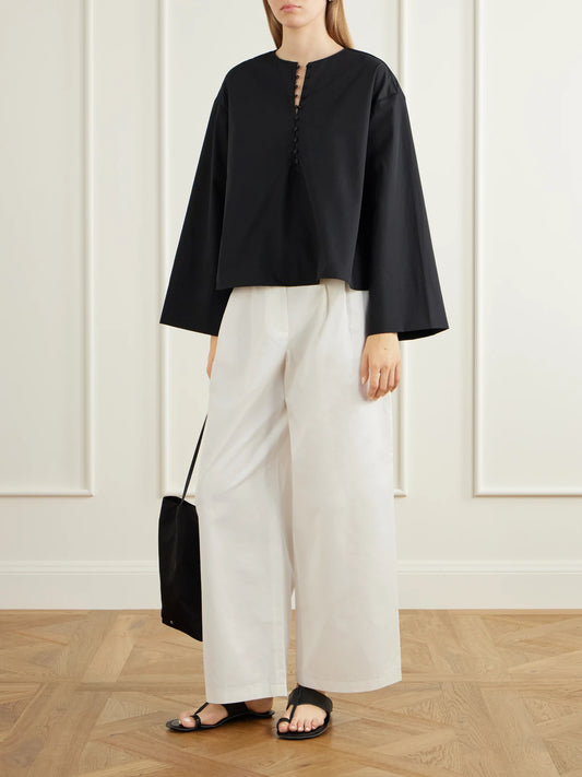 Image of a model wearing Tops. Product name - Marguerite Cotton-poplin Blouse in Black colour by brand - KALLMEYER