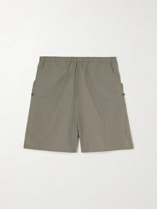 Image of a model wearing Shorts. Product name - Checked Organic Cotton Straight-leg Shorts in Dark green colour by brand - Deiji Studios