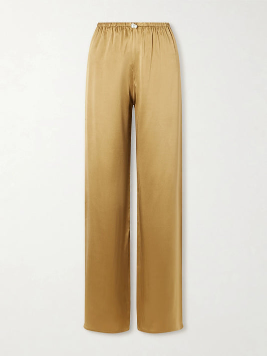 Image of a model wearing Pants. Product name - Playa Silk-satin Straight-leg Pants in Gold colour by brand - Sara Cristina