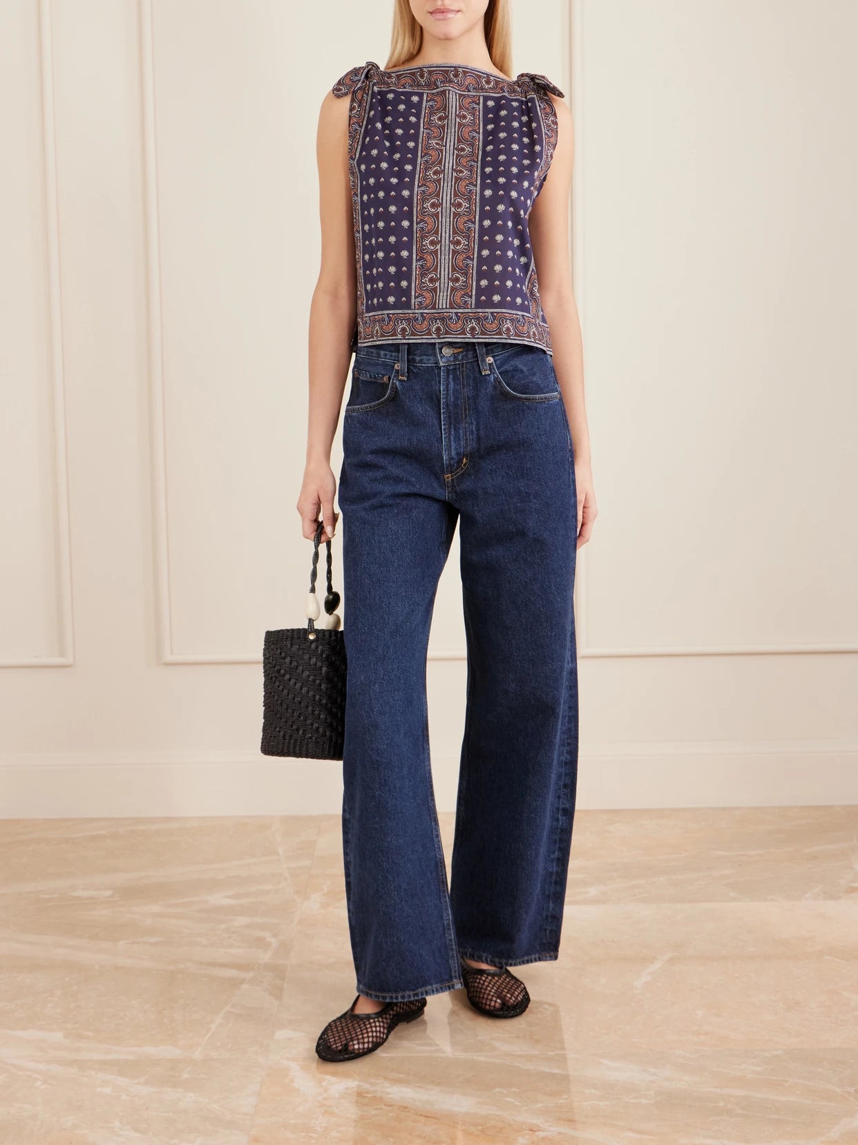 Image of a model wearing Tops. Product name - Amalia Printed Organic Cotton Top in Blue colour by brand - DÔEN