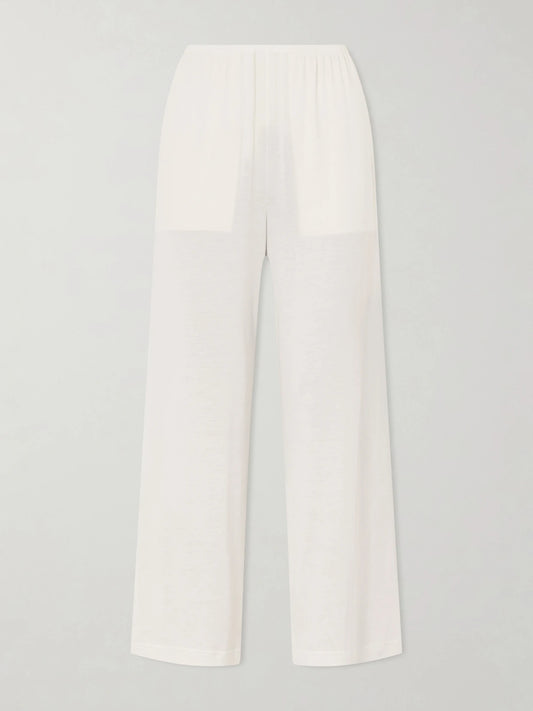 Image of a model wearing Pants. Product name - Cotton And Silk-blend Straight-leg Pants in White colour by brand - TOTEME