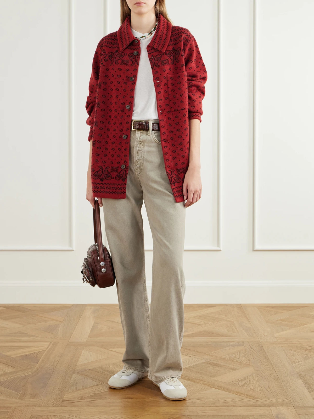 Image of a model wearing Outerwear. Product name - Wild Rag Intarsia Cashmere Cardigan in Red colour by brand - Guest In Residence