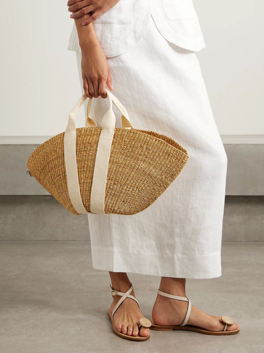 Image of Bags. Product name - Sophie Canvas-trimmed Woven Straw Tote in Brown colour by brand - MUUÑ