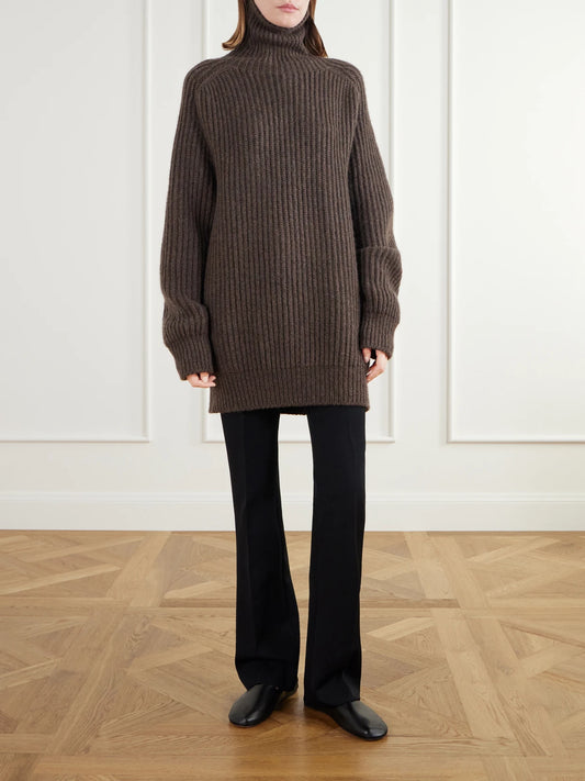 Image of a model wearing Outerwear. Product name - Vinas Oversized Ribbed Cashmere Turtleneck Sweater in Brown colour by brand - The Row