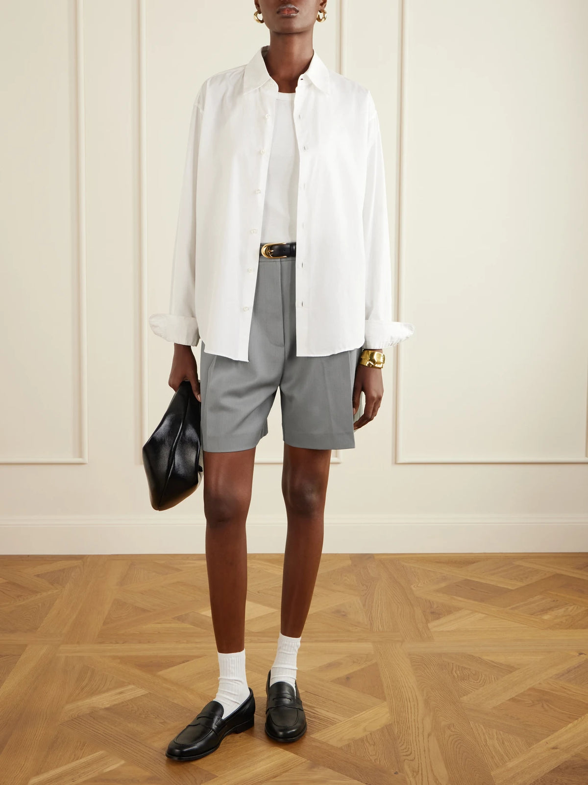 Image of a model wearing Shorts. Product name - Brice Pleated Wool-blend Shorts in Gray green colour by brand - Anine Bing