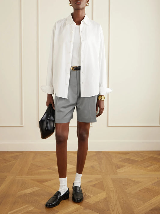 Image of a model wearing Shorts. Product name - Brice Pleated Wool-blend Shorts in Gray green colour by brand - Anine Bing
