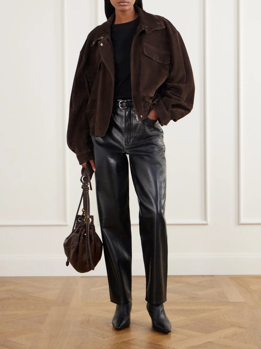Image of a model wearing Pants. Product name - Nate Leather-blend Tapered Pants in Black colour by brand - AGOLDE