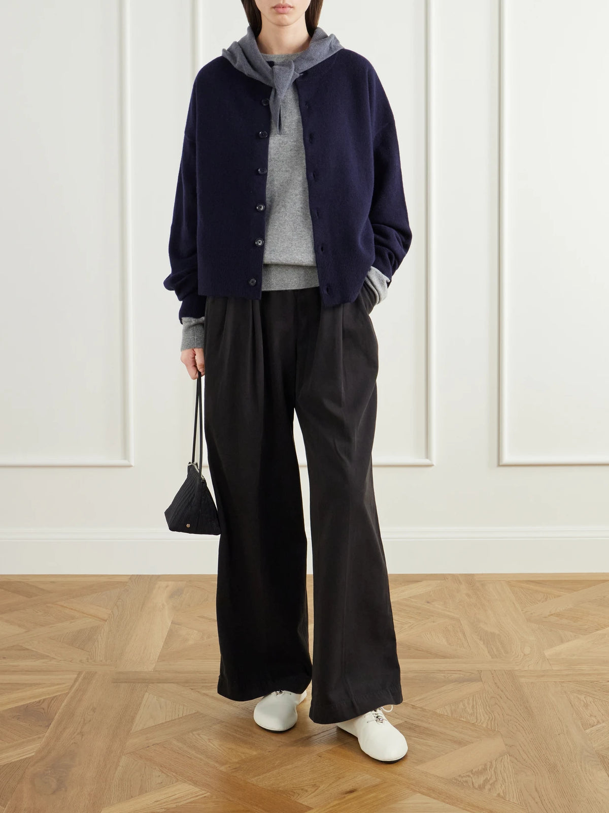 Image of a model wearing Outerwear. Product name - Cashmere-blend Cardigan in Navy colour by brand - Extreme Cashmere