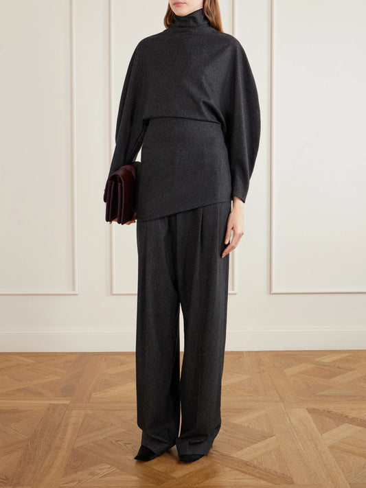 Image of a model wearing Tops. Product name - Harlow Draped Wool And Cashmere-blend Turtleneck Top in Charcoal colour by brand - KHAITE