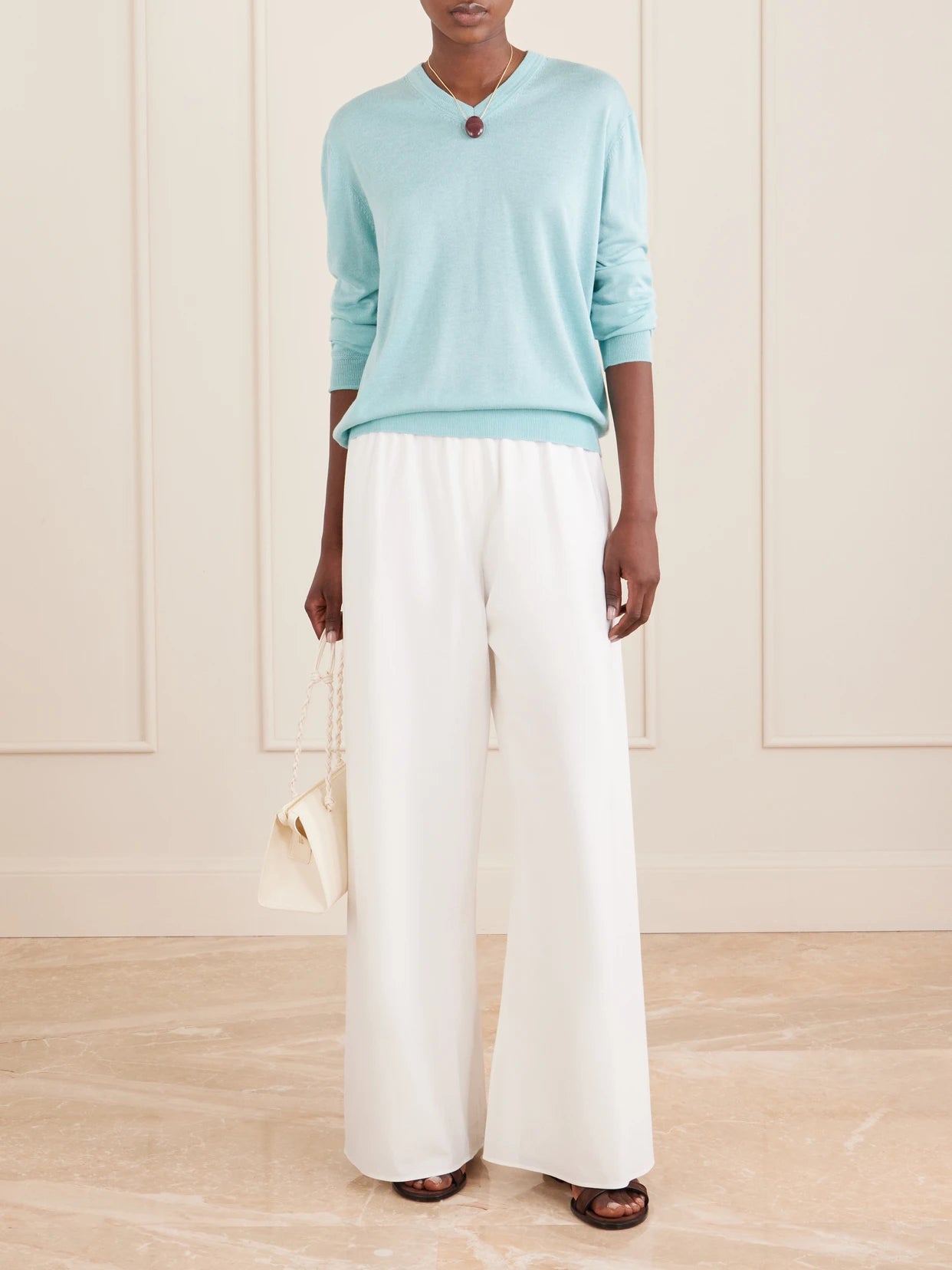 Image of a model wearing Outerwear. Product name - Ben Silk, Wool And Cashmere-blend Knit Sweater in Light blue colour by brand - La Ligne