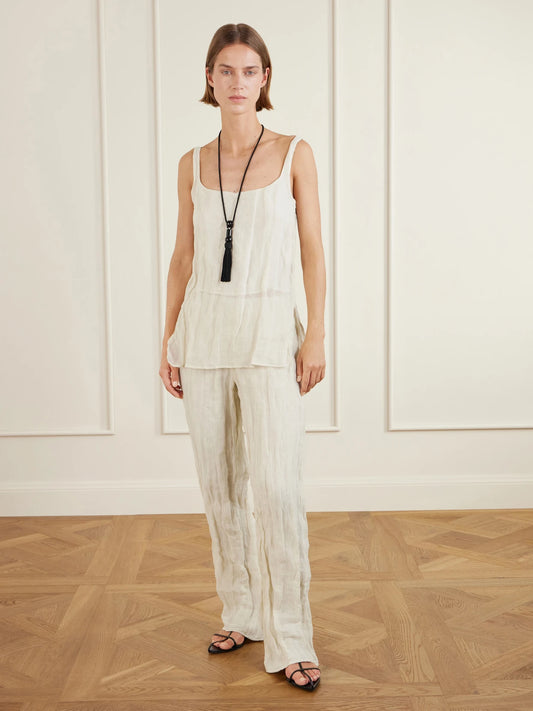 Image of a model wearing Tops. Product name - Cotton-blend Tank Top in Cream colour by brand - RÓHE