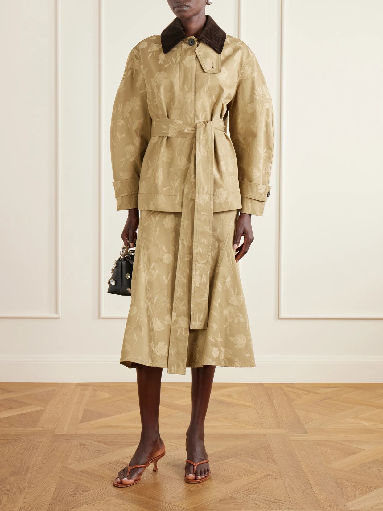Image of a model wearing Skirts. Product name - Floral-jacquard Cotton Midi Skirt in Camel colour by brand - Erdem