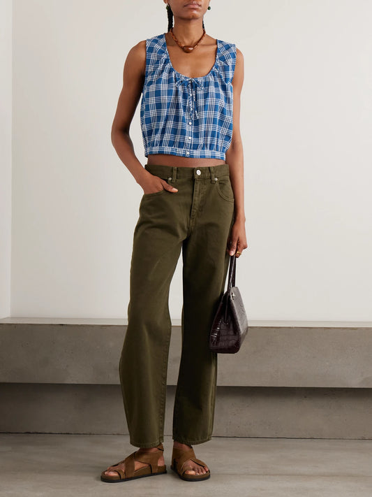 Image of a model wearing Tops. Product name - Theo Cropped Checked Organic Cotton Top in Blue colour by brand - DÔEN
