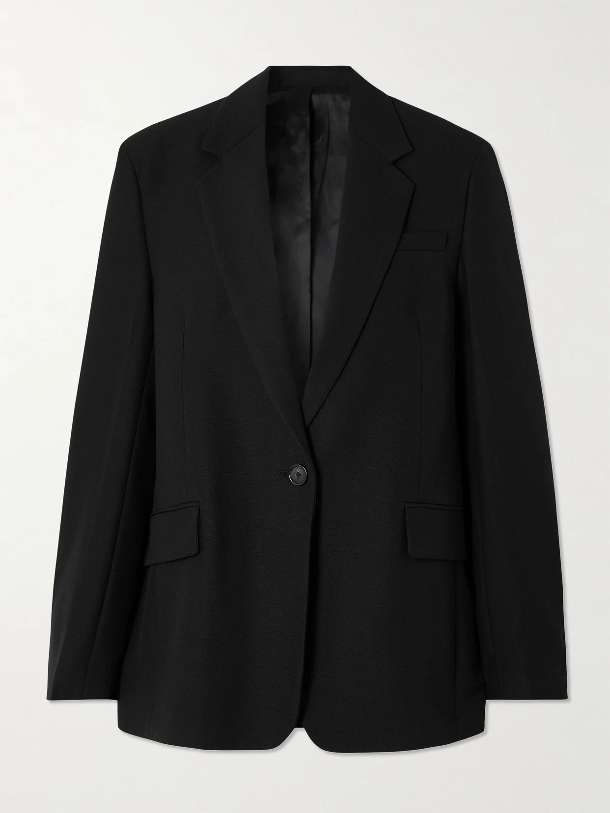 Image of a model wearing Outerwear. Product name - Garderob Oversized Recycled Grain De Poudre Blazer in Black colour by brand - TOTEME