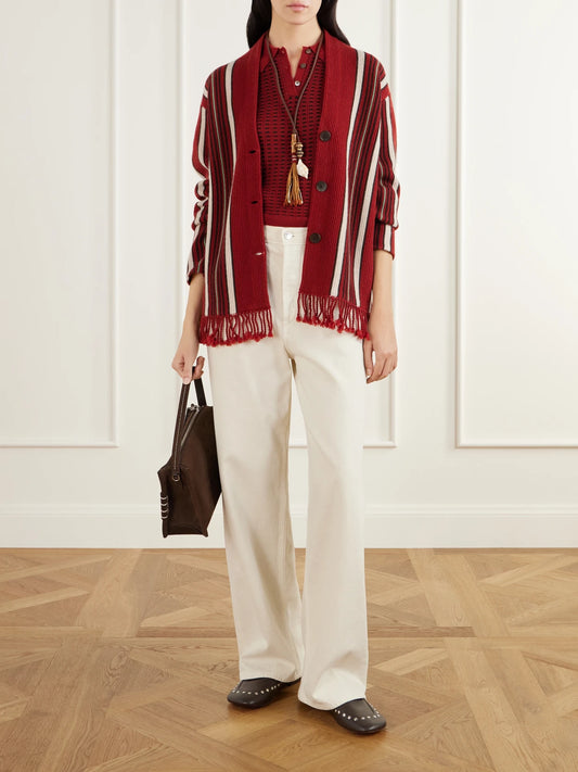 Image of a model wearing Outerwear. Product name - Shrunken Waffle Cropped Cashmere Polo Shirt in Red colour by brand - Guest In Residence