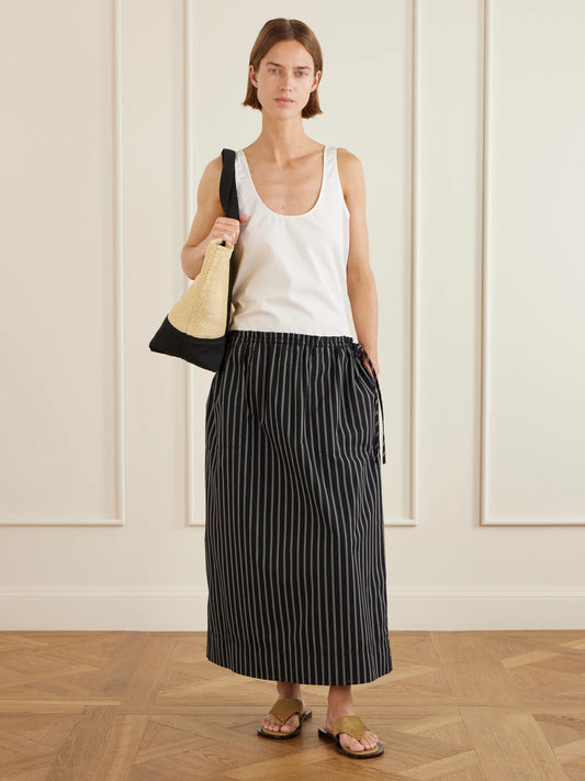 Image of a model wearing Tops. Product name - Cotton-poplin Tank in White colour by brand - TOTEME