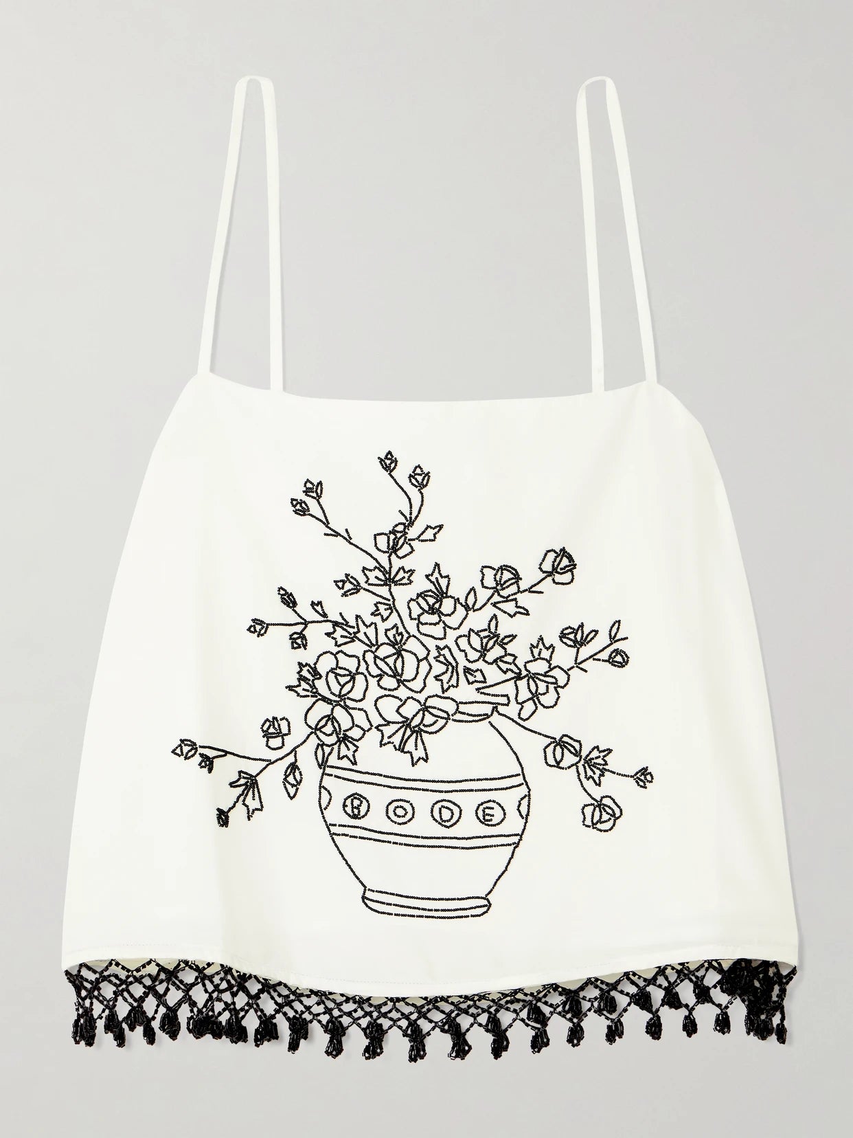 Image of a model wearing Tops. Product name - Rosebloom Cropped Bead-embellished Fringed Cotton And Silk-blend Top in White colour by brand - BODE