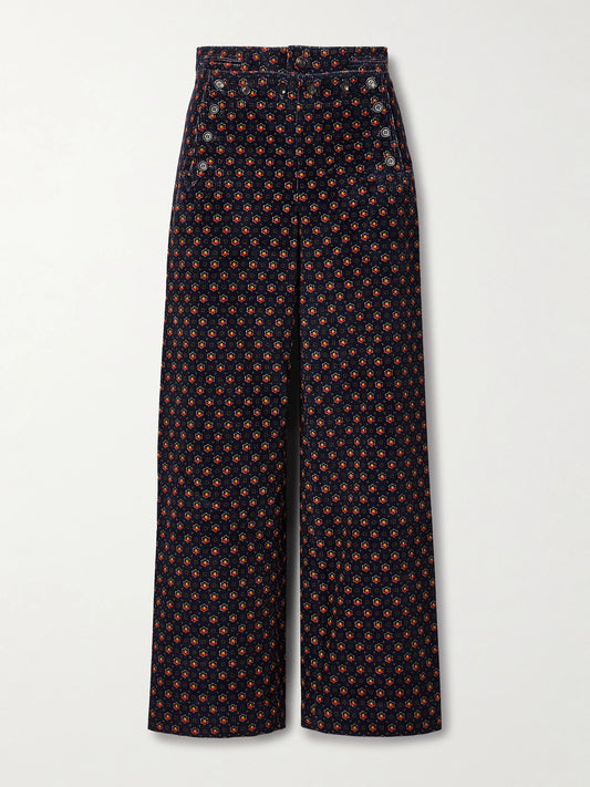 Image of a model wearing Pants. Product name - Mcallister Floral-print Cotton-corduroy Straight-leg Pants in Blue colour by brand - BODE