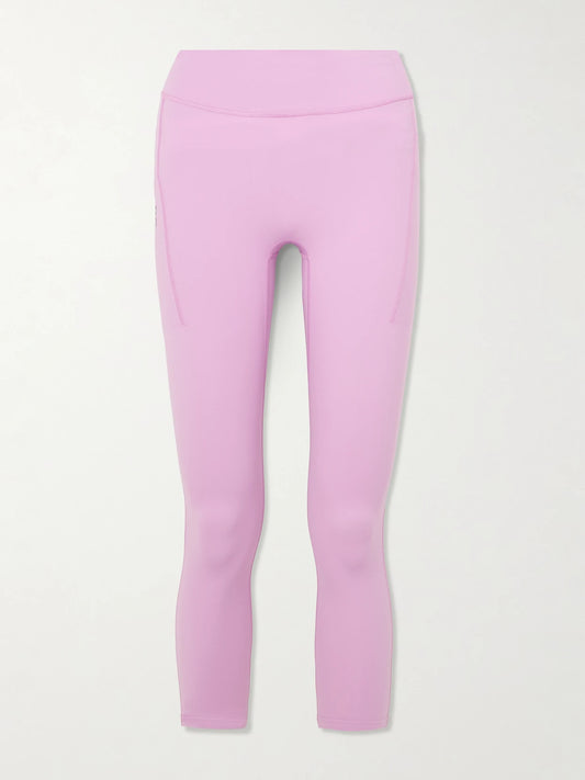 Image of a model wearing Pants. Product name - Performance 7/8 Stretch Recycled-jersey Leggings in Pink colour by brand - ON