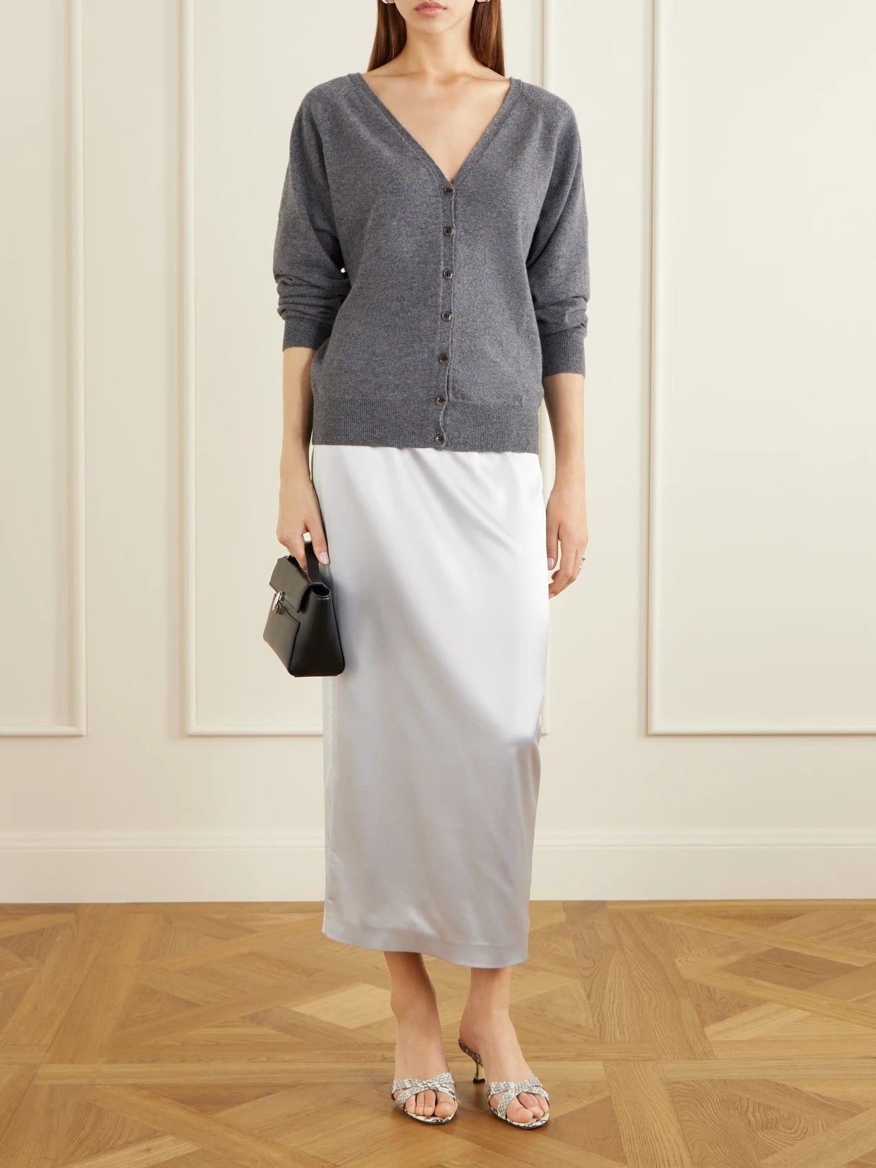 Image of a model wearing Outerwear. Product name - Jiani Cashmere Cardigan in Charcoal colour by brand - LISA YANG
