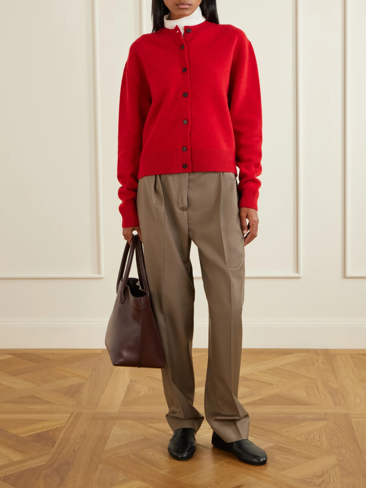 Image of a model wearing Pants. Product name - Daria Virgin Wool Tapered Pants in Brown colour by brand - RÓHE