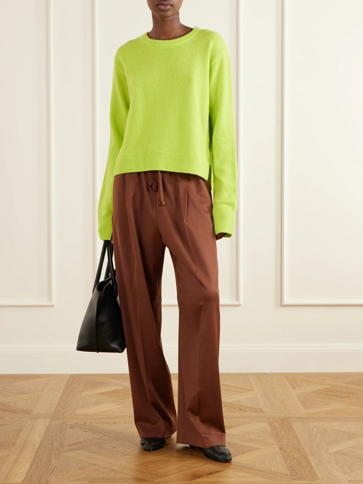 Image of a model wearing Pants. Product name - Pleated Wool-blend Straight-leg Pants in Brown colour by brand - Another Tomorrow