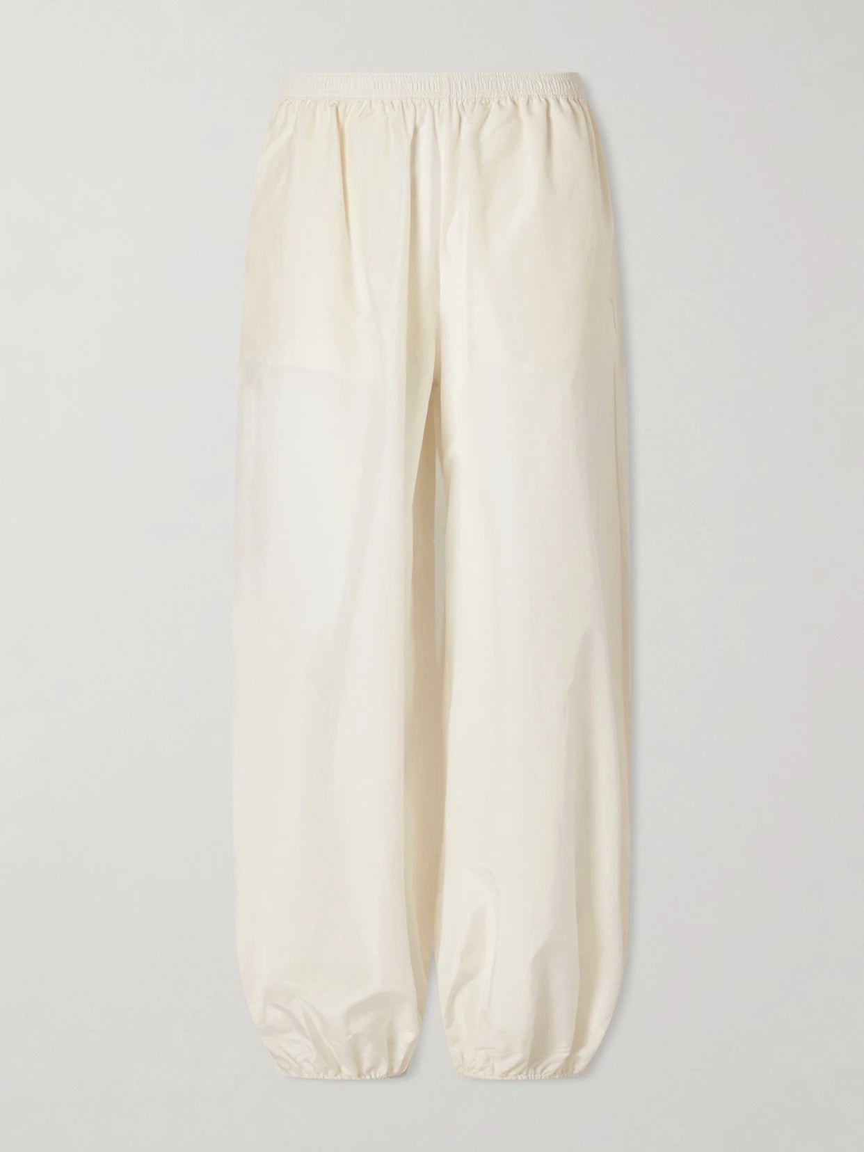 Image of a model wearing Pants. Product name - Almaya Cotton And Silk-blend Balloon Pants in Ivory colour by brand - Loulou de Saison