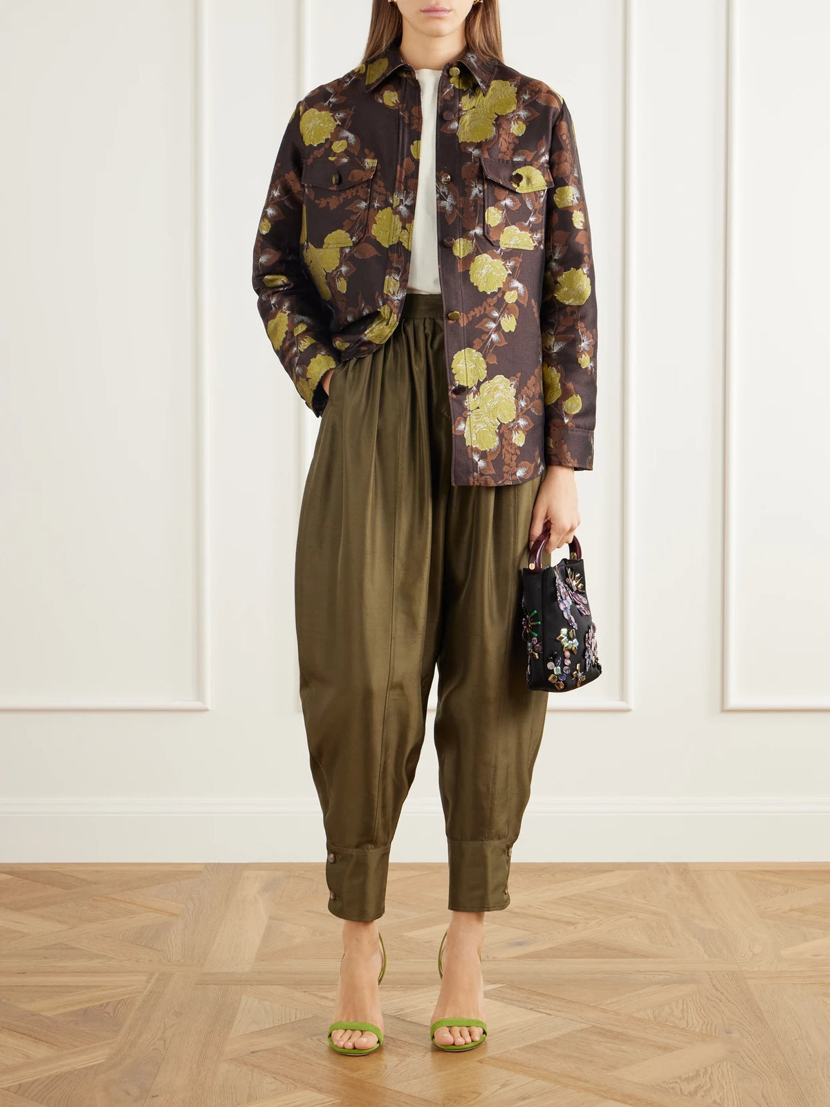 Image of a model wearing Pants. Product name - Harem Pleated Silk-shantung Tapered Pants in Green colour by brand - La DoubleJ