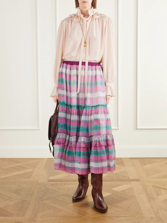 Image of a model wearing Skirts. Product name - Drawstring Ruffled Checked Silk-mousseline Maxi Skirt in Pink colour by brand - Chloé