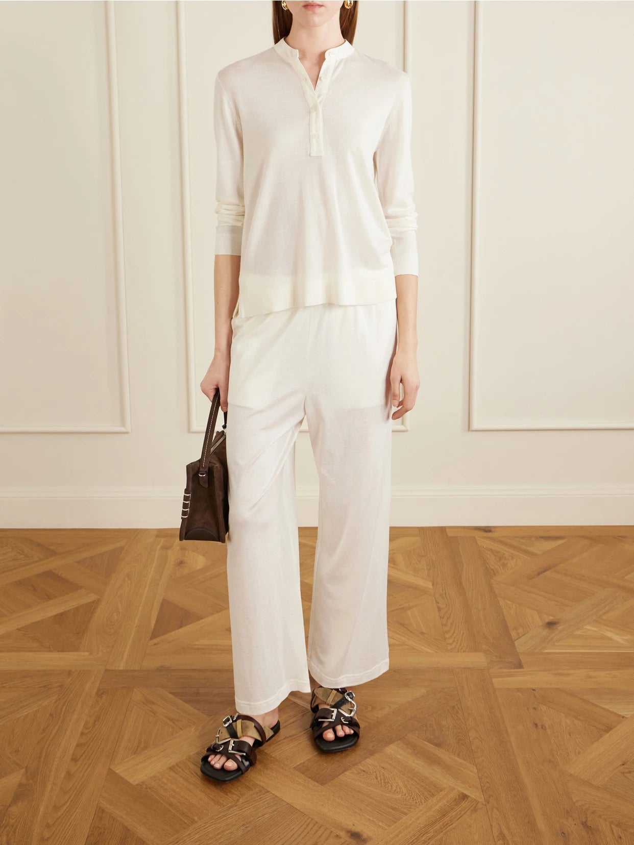 Image of a model wearing Outerwear. Product name - Wool And Silk-blend Sweater in Off-white colour by brand - TOTEME