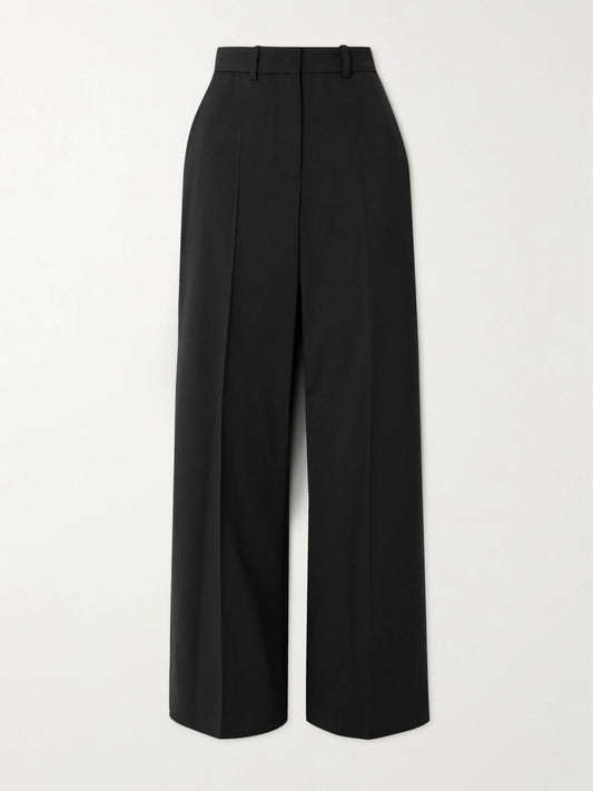 Image of a model wearing Pants. Product name - Morissey Pleated Stretch-wool Twill Straight-leg Pants in Black colour by brand - Joseph