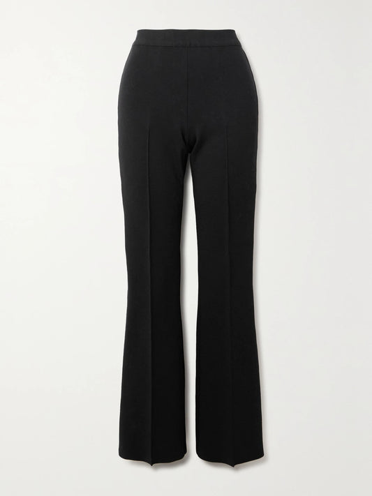 Image of a model wearing Pants. Product name - Long Kick Stretch-cotton Flared Pants in Black colour by brand - HIGH SPORT