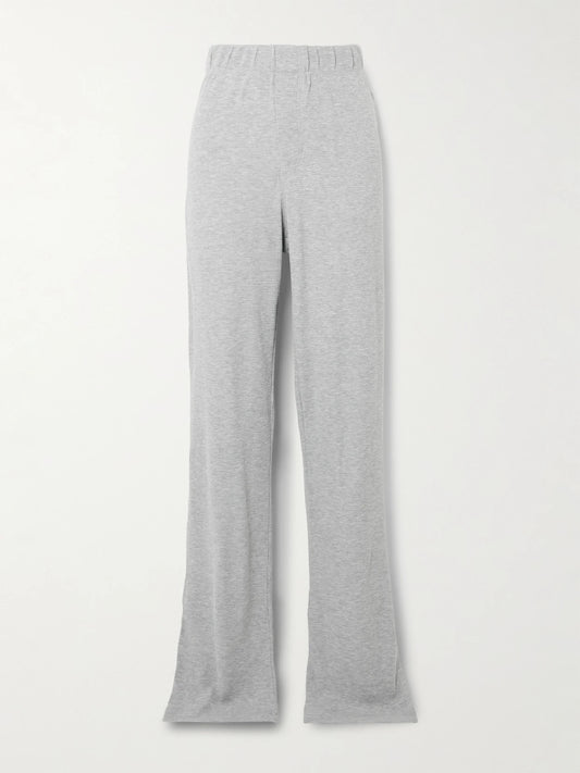 Image of a model wearing Tops. Product name - Waffle-knit Jersey Track Pants in Light gray colour by brand - ÉTERNE