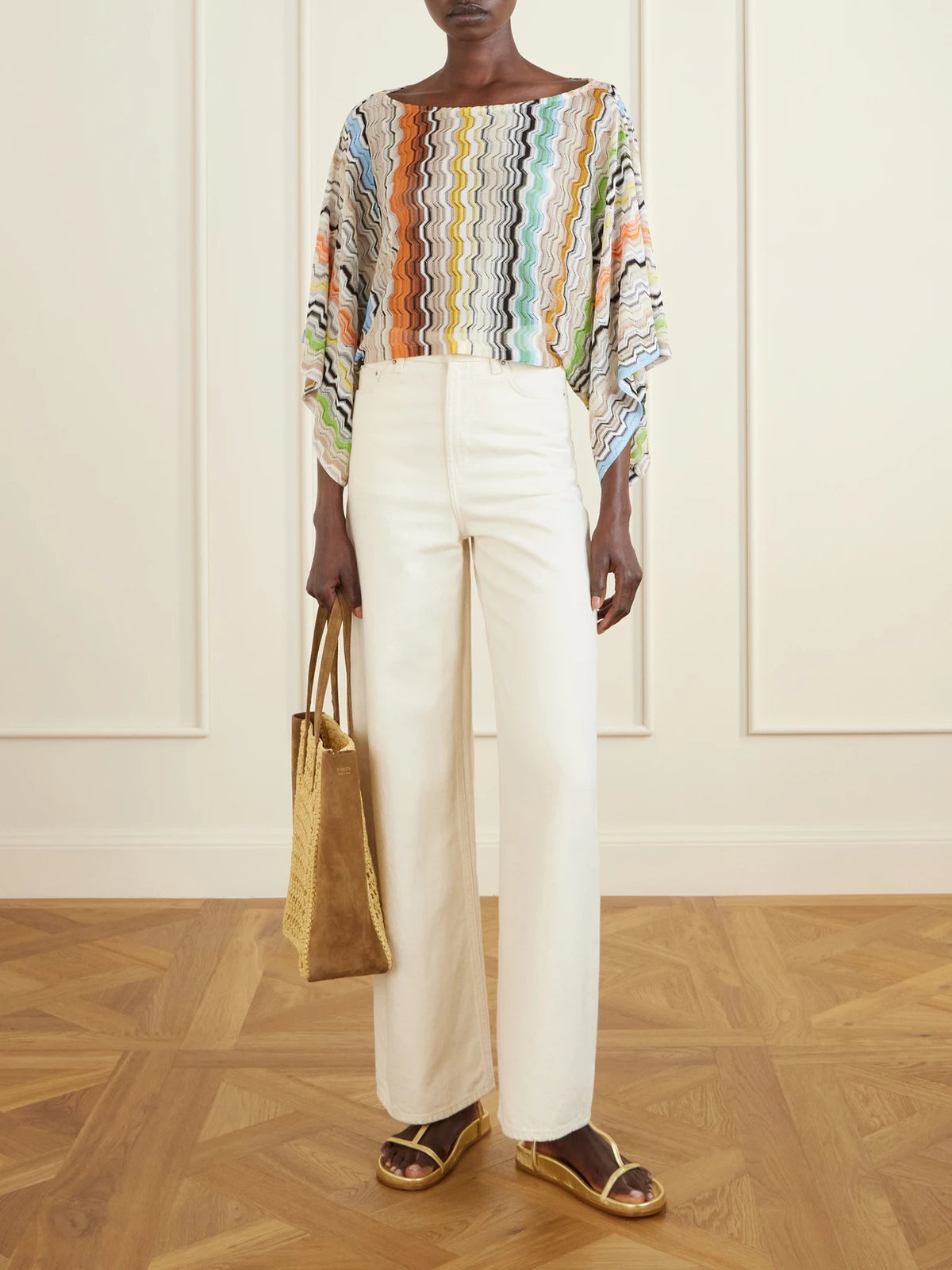 Image of a model wearing Tops. Product name - Striped Crochet-knit Top in Multi colour by brand - Missoni