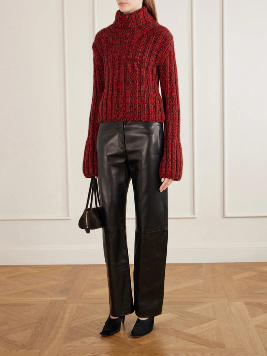 Image of a model wearing Outerwear. Product name - Kelly Ribbed Cashmere Sweater in Red colour by brand - KHAITE