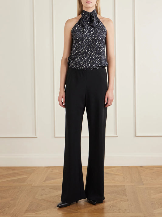 Image of a model wearing Tops. Product name - Alla Polka-star Silk Halterneck Blouse in Black colour by brand - Nili Lotan
