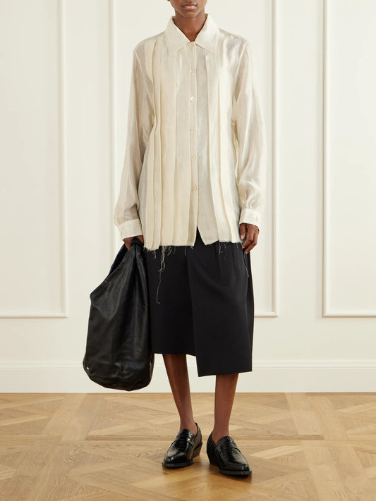 Image of a model wearing Tops. Product name - Tuxedo Every Satin Shirt in Cream colour by brand - Our Legacy