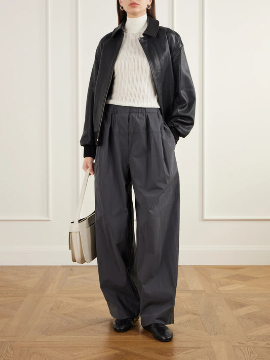 Image of a model wearing Outerwear. Product name - Pointelle-knit Merino Wool Mock-neck Top in Ivory colour by brand - Maria McManus