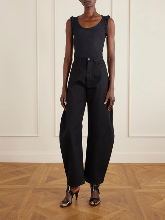 Image of a model wearing Tops. Product name - Ribbed Modal-blend Jersey Bodysuit in Black colour by brand - Alaïa