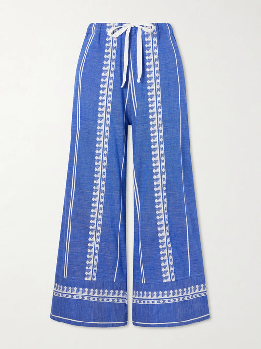 Image of a model wearing Pants. Product name - Desta Straight-leg Cotton Pants in Blue colour by brand - lemlem