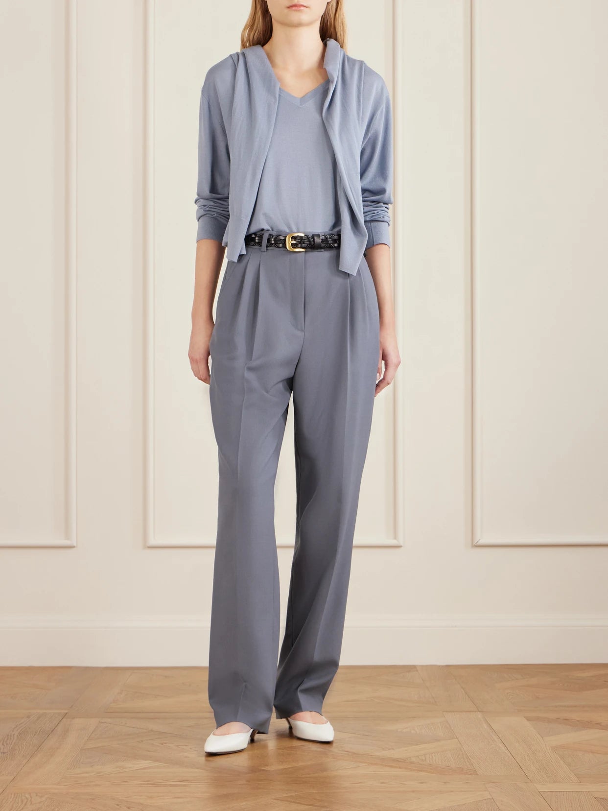 Image of a model wearing Outerwear. Product name - Naius Wool Sweater in Light blue colour by brand - The Row