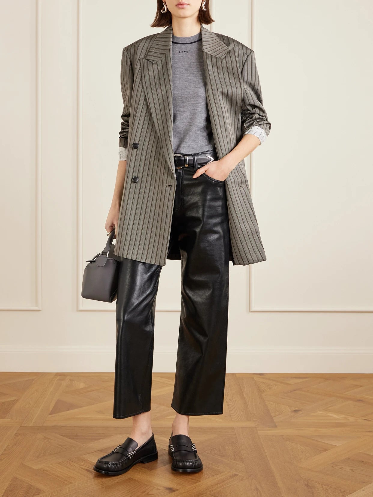 Image of a model wearing Tops. Product name - Piped Wool T-shirt in Gray colour by brand - LOEWE