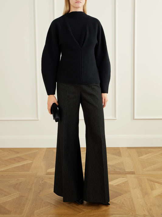 Image of a model wearing Pants. Product name - Diana High-rise Wide-leg Jeans in Black colour by brand - Carolina Herrera