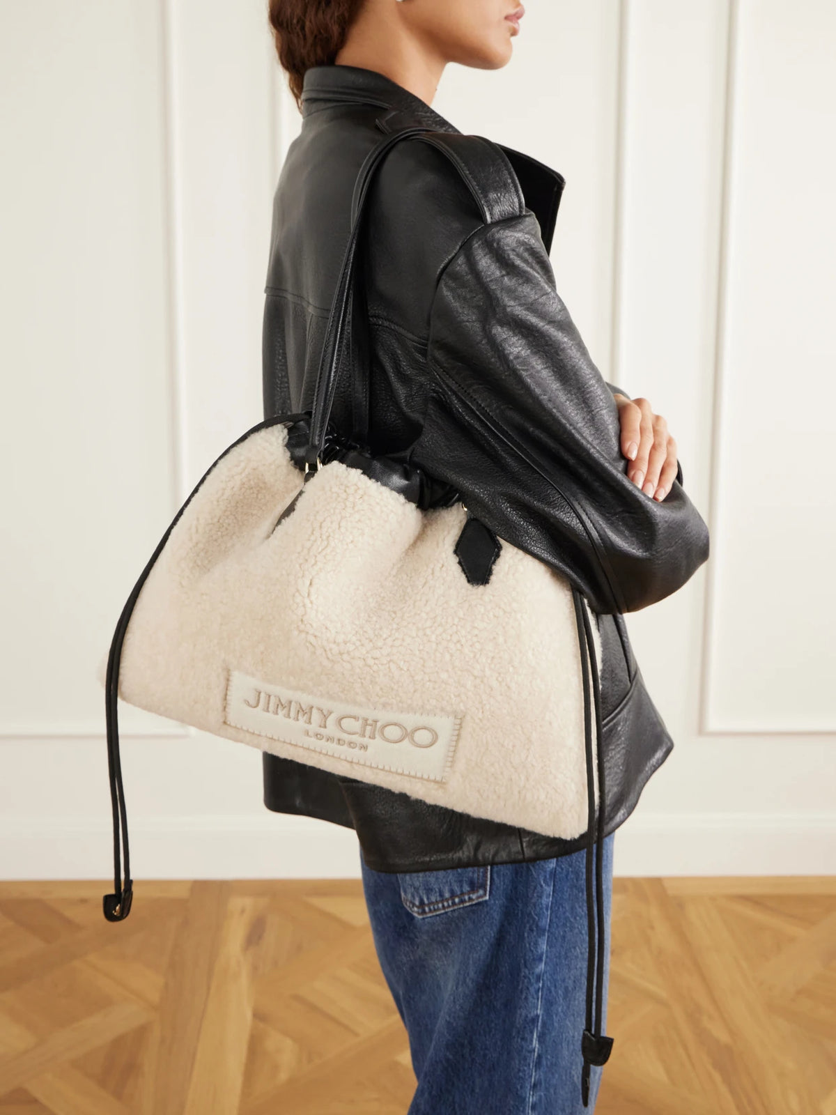 Image of Bags. Product name - Drawstring Leather-trimmed Shearling Shoulder Bag in Off-white colour by brand - Jimmy Choo